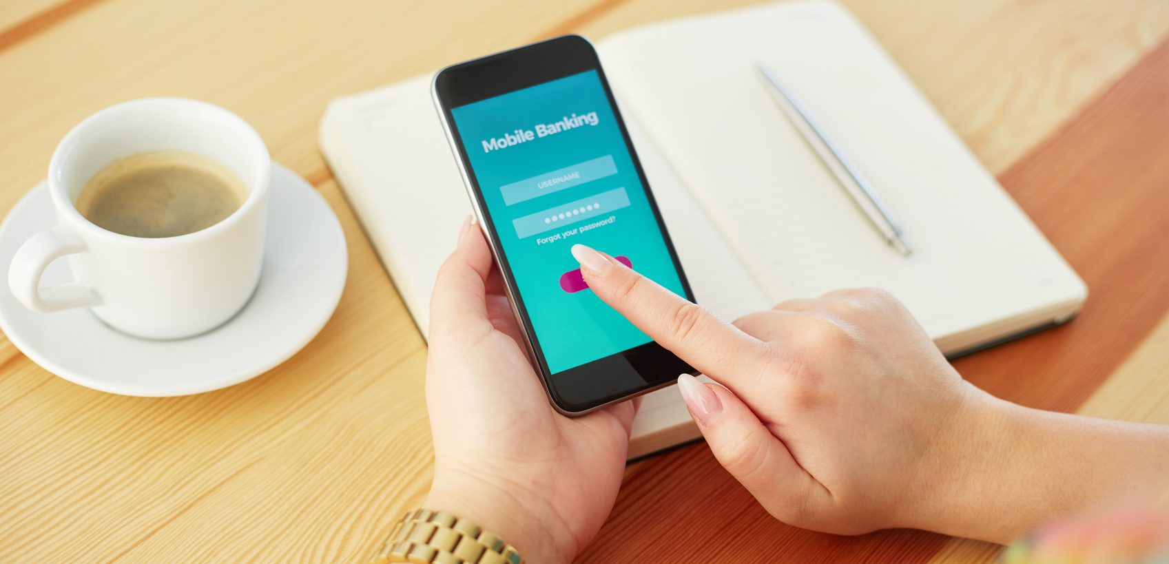 Woman with smartphone is trying to log into mobile banking